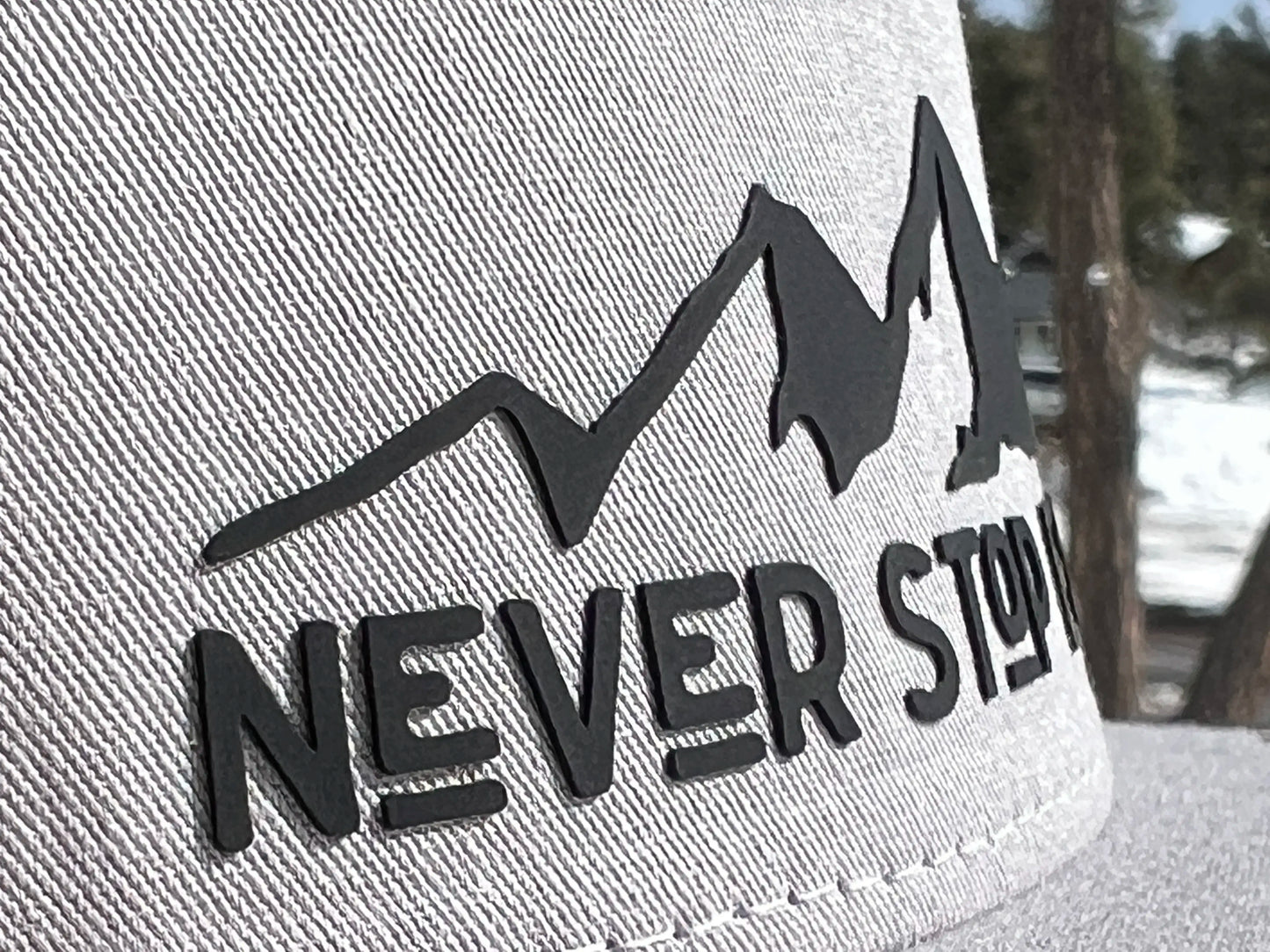 Never stop exploring mountain premium trucker cap outdoor activities