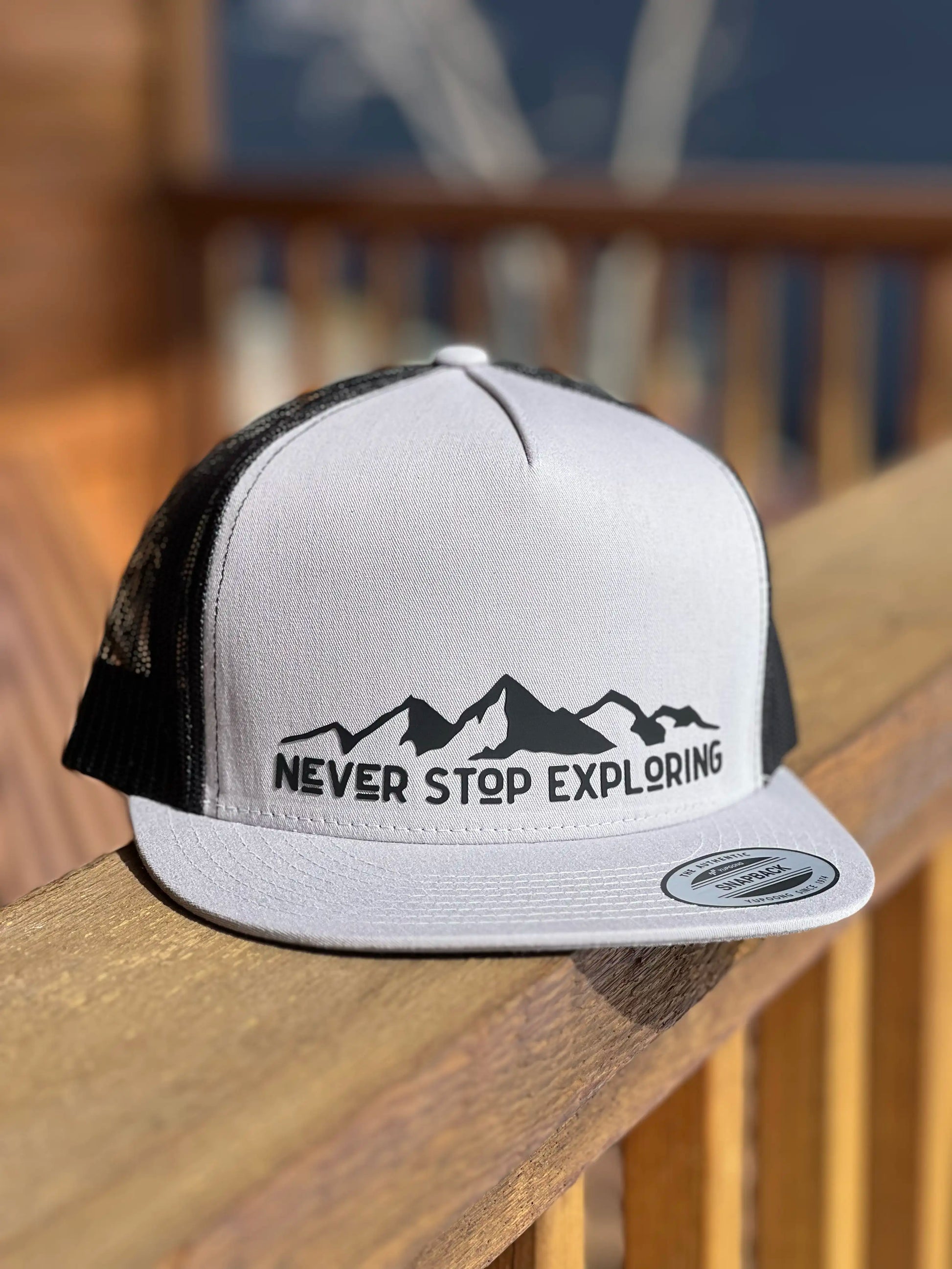 Never stop exploring mountain premium trucker cap outdoor activities